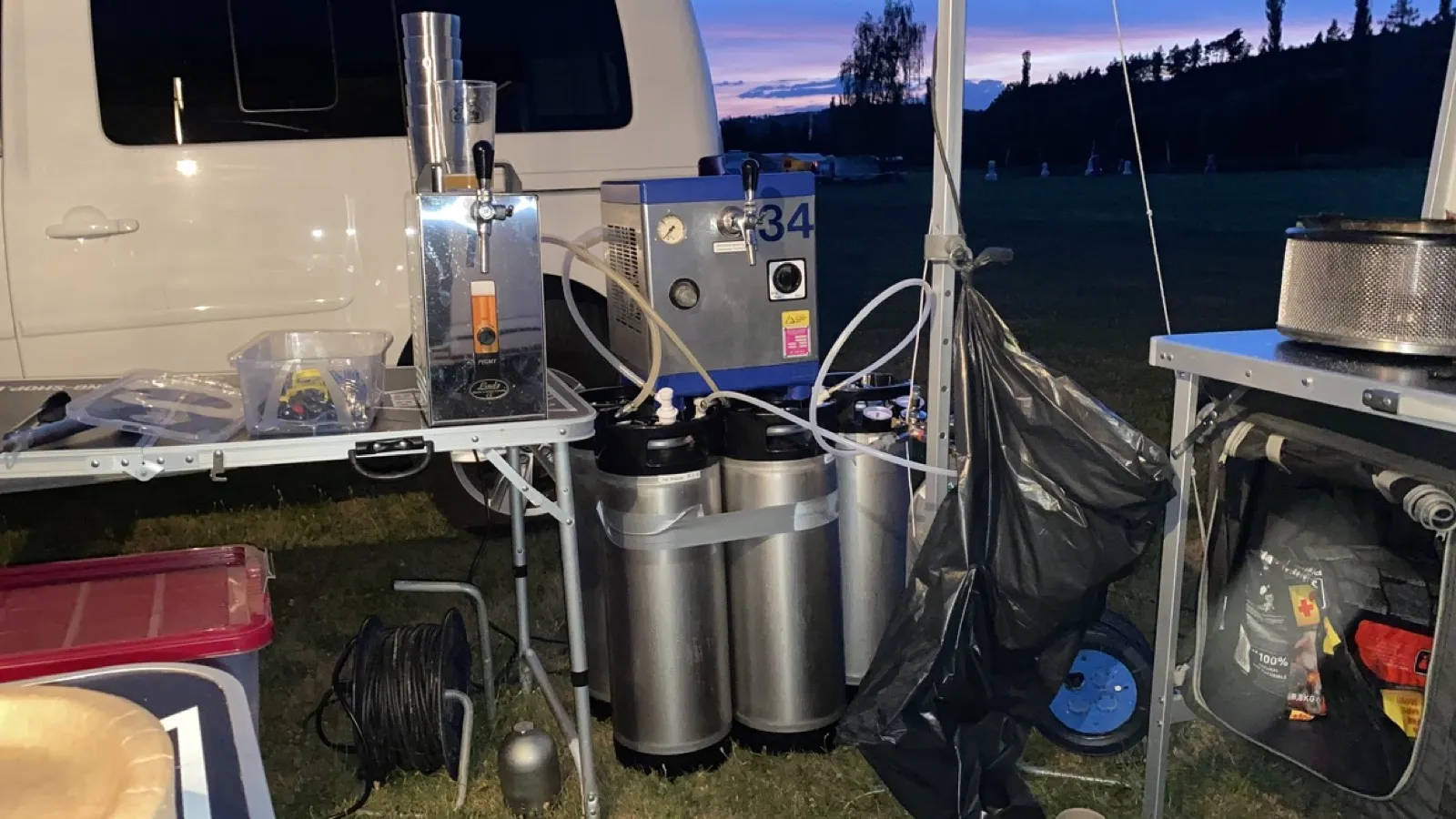 Draft beer station at camping sunset