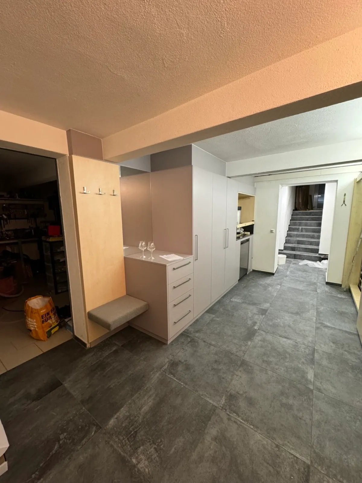 New entrance with furniture and tiles